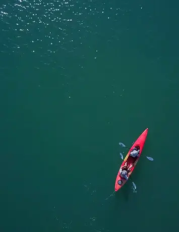 Young people rowing in a canoe